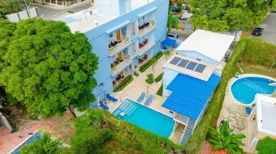 an overhead view of a blue building with a pool at Casa de Compai Unit 9 AC WiFi Prime Location in Sosúa