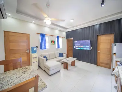a living room with a couch and a table at Casa de Compai Unit 9 AC WiFi Prime Location in Sosúa