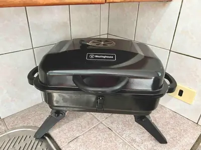 a black toaster sitting on top of a stove at 2 Bedroom Villa with private Pool in Sosua in Sosúa