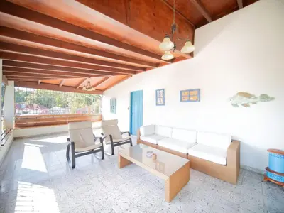 a living room with a couch and a table at HUGE Balcony APT next to HARD ROCK CAFE and Beach in Sosúa