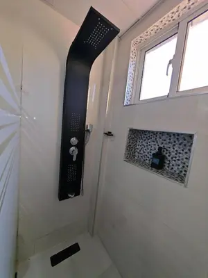 a bathroom with a shower with a window and a shower at 2 Bdrm 1 Bath Near River and Beach, 3L, Paraíso, Barahona in Paraíso