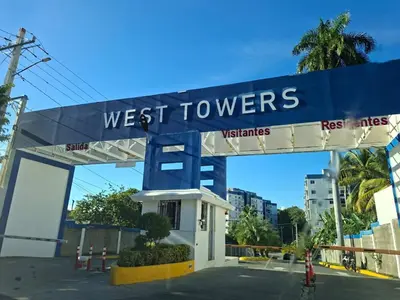 a sign for a west towers gas station at Apartment in Santo Domingo in El Caliche