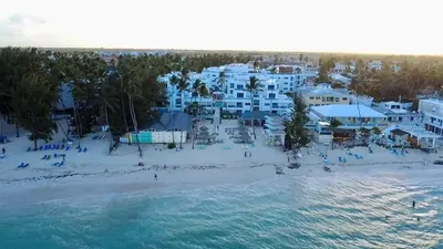 an aerial view of a beach and buildings at Large apartment at the foot of the beach in Punta Cana
