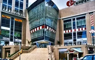 a large glass building with stairs in front of it at Central and spacious, 3-bedroom apartment in Santo Domingo in Colorado