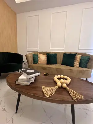 a coffee table in a living room with a couch at Los Corales del Sur- Entire rental unit in Santo Domingo Este, Dominican Republic in Ensanche Savica de Mendoza