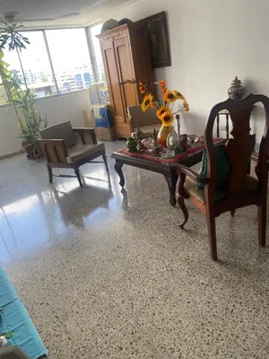 a living room with a table and two chairs at Torre armonía in Punta