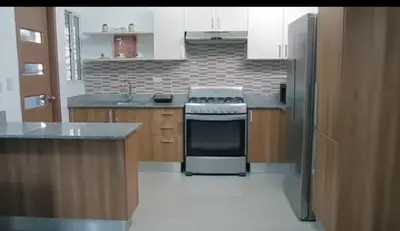 a kitchen with a stove and a sink in it at Mediterrao santiago in Canabacoa