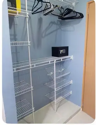 a closet with empty shelves in a room at Spacious 3BR Duplex with Private Rooftop , Ideal for Monthly & Corporate Stays in San Isidro