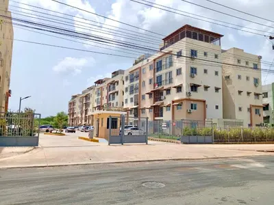 a large apartment building on a city street at Spacious 3BR Duplex with Private Rooftop , Ideal for Monthly & Corporate Stays in San Isidro
