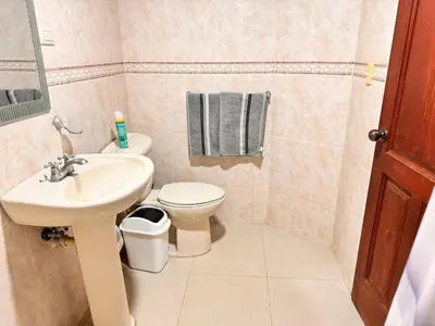 a bathroom with a sink and a toilet at Cozy Huge and Lovely 3 bedrooms apts 2bathdrooms in La Estrella