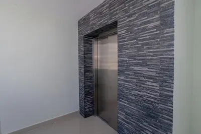 a hallway with a brick wall and a door at Tropical Studio Getaway in Bayahibe in San Rafael del Yuma