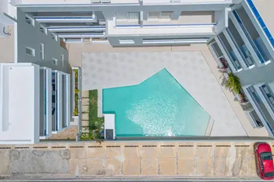 an aerial view of a building with a swimming pool at Tropical Studio Getaway in Bayahibe in San Rafael del Yuma