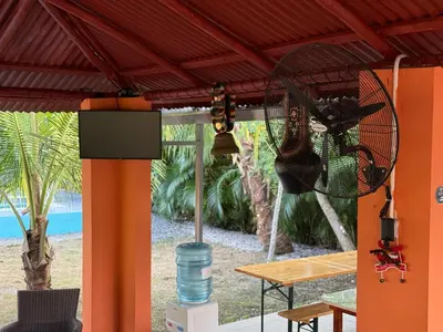 a room with a table and a fan at Rancho Doña Rita in Higuey
