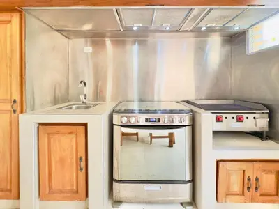 a kitchen with a stove and a sink at Family Villa Terrenas Samana Near the Beach in Las Terrenas