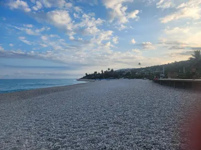 a rocky beach with a cloudy sky and the ocean at 2 Bdrm, 1 Bath, Wifi, Near River and Beach, 3R in Paraíso