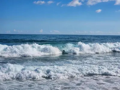 a group of small waves in the ocean at 2 Bdrm, 1 Bath, Wifi, Near River and Beach, 3R in Paraíso