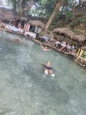 a woman swimming in a pool in the water at 2 Bdrm 1 Bath Near River and Beach, 3L in Paraíso