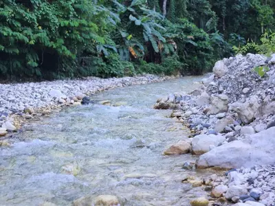 a river with rocks and trees in the background at 2 Bdrm 1 Bath Near River and Beach, 3L in Paraíso