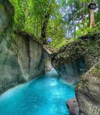 a person standing on the side of a river at Apartment-View-Beach-Mountains-Rivers-WiFi-AC-CLB in Santa Cruz de Barahona