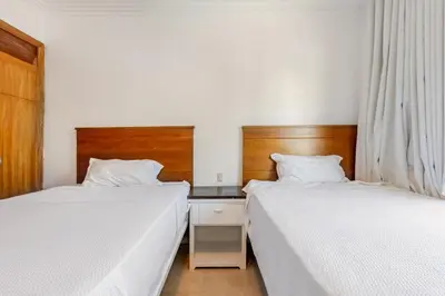 two beds sitting next to each other in a bedroom at First Line, Direct Access to Private Beach in Punta Cana