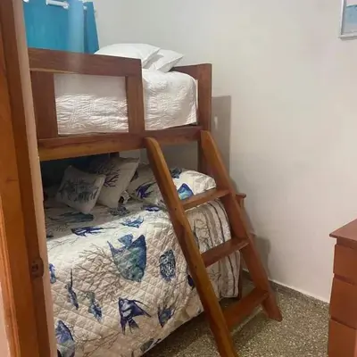 a bunk bed in a room with a bunk bedutenewayangering at Casita Linda Playas Rios Wifi Agua HOT AC and more in Paraíso