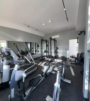 a gym with two exercise bikes in a room at Apartment in Evaristo Morales, National District in Santo Domingo