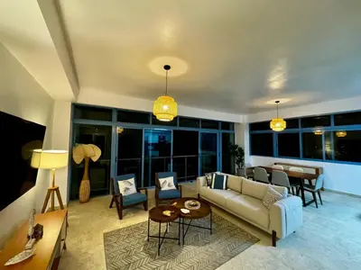 a living room with a couch and a table at Juan Dolio 2BR Apt Beach front in Juan Dolio