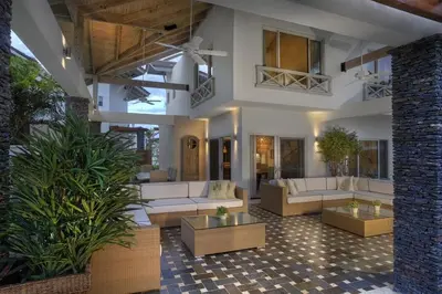 a living room with couches and tables and plants at Oceanfront PH Jacuzzi Balconies of the Atlanti in El Limón