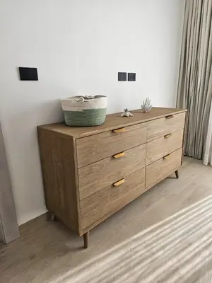 a wooden dresser with a basket on top of it at Aqua Esmeralda Beachfront Apartment Trinidad 103 in La Laguna