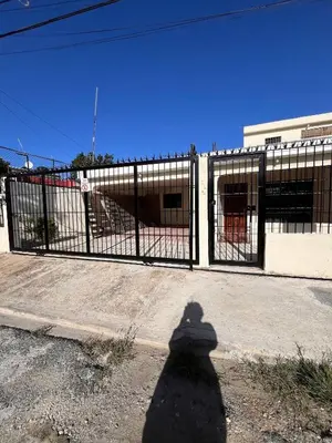 a shadow of a person standing in front of a fence at Beautiful Quiet shared home in Santo Domingo