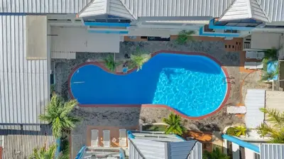 an overhead view of a swimming pool at a hotel at Cheap Hotel Room in Sosua Strip in Sosúa