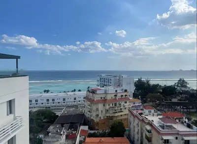 a view of a city with the ocean and buildings at Majestic 2Bd Ocean view Apartment Boca Del Mar III in Boca Chica