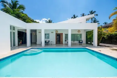 a swimming pool in front of a villa at Lux villa playa bonita in Las Terrenas