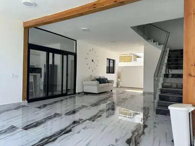 a living room with a marble floor and stairs at Villa Las Terrenas Near Playa Bonita Pool in Las Terrenas