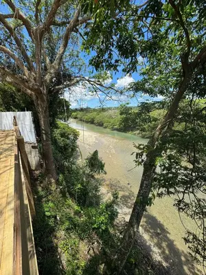 a view of a river from a wooden bridge at Las Indgenas 6BR Pool Jacuzzi Gazebo in Imbert