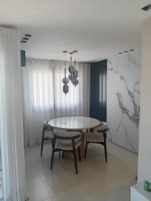 a dining room with a table and chairs at Ecológica in Los Paredones