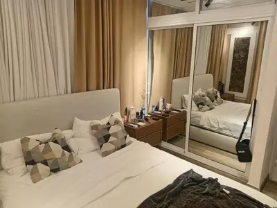 a bedroom with a bed and a large mirror at Ecológica in Los Paredones