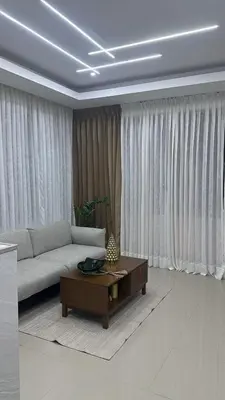 a living room with a couch and a coffee table at Hotel Evers in Azua