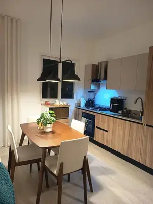 a kitchen and dining room with a table and chairs at Cozy tiny home by the beach in La Laguna