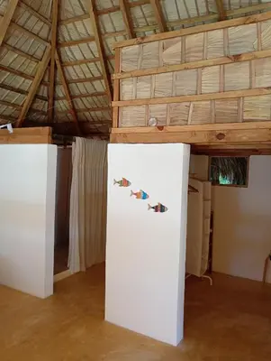a room with a white refrigerator and a wooden ceiling at Mejor, Quédate Aquí in Las Galeras