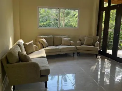 a living room with couches and chairs and a window at Villa Reyes Vega - Private Pool & BBQ - La Colonia, SC in La Cabirma