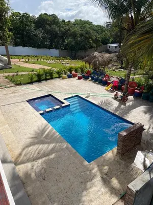 a swimming pool in the middle of a yard at Rancho Paraíso Escondido