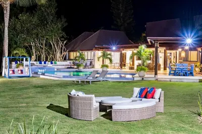 a villa with a swimming pool at night at Villa Reme 19 in La Romana