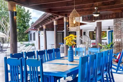 a blue table and chairs on a patio at Villa Reme 19 in La Romana