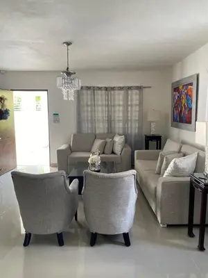 a living room with a couch and chairs at Casa de campo Ana Victoria