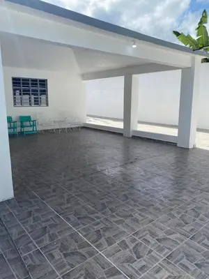 a large room with a stone floor and white walls at Casa de campo Ana Victoria
