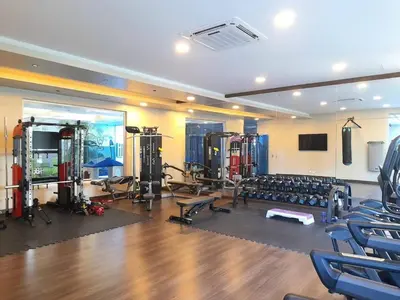 a gym with chairs and equipment in a room at Luxury 3-Bedroom Apartment with Pool in Naco, Santo Domingo in Santo Domingo