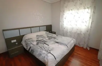 a bedroom with a bed and a window at Casamesa-14 in Los Alcarrizos