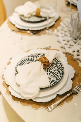 a table with plates and napkins on top of it at Aqua Luxe Opulence Vista Piscina & Golf · by Sun5 in Punta Cana