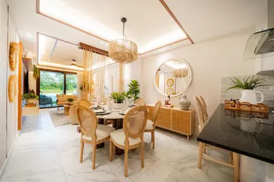 a dining room with a table and chairs at Aqua Luxe Opulence Vista Piscina & Golf · by Sun5 in Punta Cana